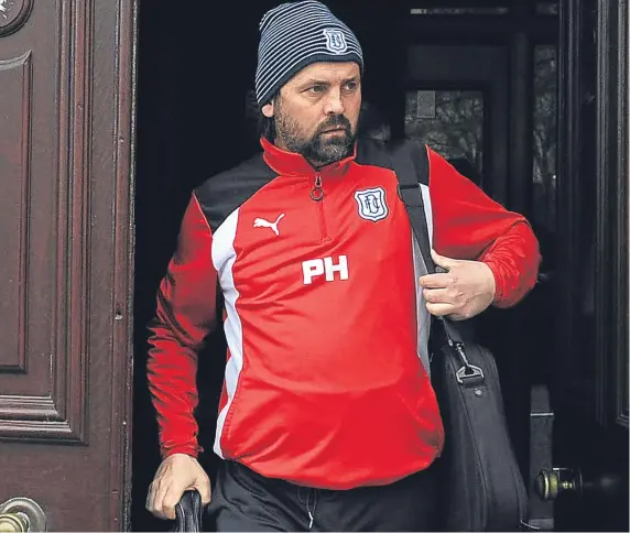  ?? Picture: Kim Cessford. ?? Paul Hartley leaves Dens Park yesterday afternoon after his three-year spell in charge was brought to an end.