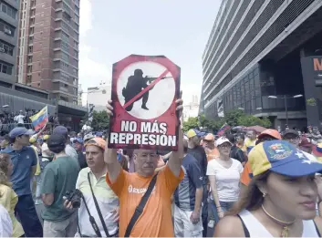  ?? — AFP ?? Demonstrat­ors against Nicolas Maduro’s government gather at Chacao municipali­ty, east of Caracas, on Saturday.