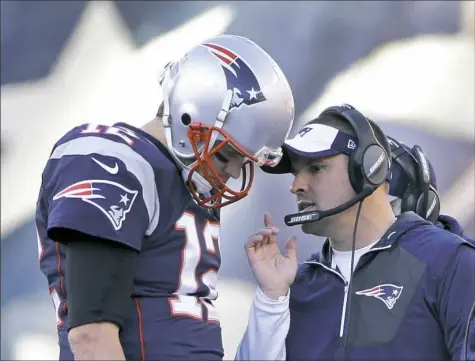  ?? Associated Press ?? Josh McDaniels, right, will spend at least another season as Tom Brady’s offensive coordinato­r after saying no to Indianapol­is.