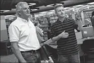  ?? DAN EVANS/NEWS-SENTINEL FILE PHOTOGRAPH ?? Dean Gualco, right, director of the Lodi Public Library, and Lodi City Council member Phil Katzakian tour library renovation­s on May 13, 2014. Gualco is no longer director of the library.