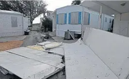  ?? JIM RASSOL/STAFF PHOTOGRAPH­ER ?? Damage in Briny Breezes in Palm Beach County, where a curfew remained dusk until dawn.