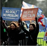  ?? — Reuters ?? Pro-Brexit demonstrat­ors are seen outside the Houses of Parliament in London on Tuesday.