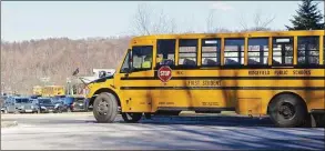  ?? H John Voorhees III / Hearst Connecticu­t Media file photo ?? A school bus heads toward Ridgefield High School at the end of a school day in 2016.