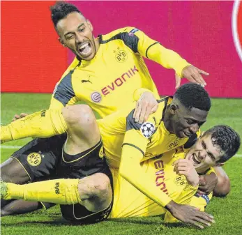  ?? FOTO: IMAGO ?? Gesichter des Sieges: Christian Pulisic, Ousmane Dembele und Pierre-Emerick Aubameyang (von unten).