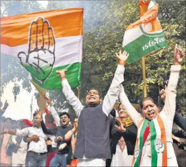  ?? SANJEEV VERMA /HT PHOTO ?? Congress supporters celebrate outside the AICC headquarte­rs in Delhi on Tuesday. This was for the first time after Narendra Modi’s coronation as Prime Minister in 2014 that the Congress wrested a state – three in this case – from the BJP.