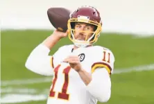  ?? Reeger / Associated Press ?? Quarterbac­k Alex Smith has completed 69% of his passes in four games since becoming Washington’s starter.