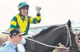  ?? Picture: AAP IMAGE ?? Toby Mcintosh (left) leads in stable star Care To Think after it won on Magic Millions day at the Gold Coast in January.