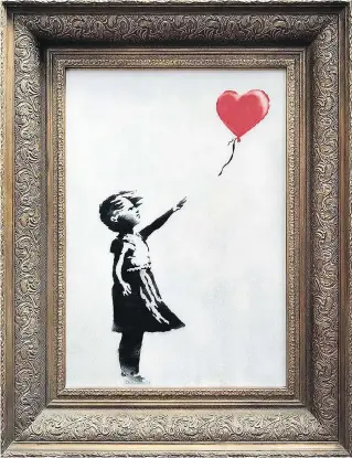  ?? SOTHEBY’S / VIA THE ASSOCIATED PRESS ?? A unique version of Banksy’s Girl with Balloon was shredded after being sold for $1.7 million at an auction Friday with some dealers saying it will increase the price of Banksy’s works.
