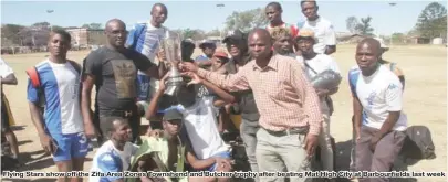  ??  ?? Flying Stars show off the Zifa Area Zones Townshend and Butcher trophy after beating Mat High City at Barbourfif­i elds last week