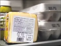  ?? Charles Rex Arbogast Associated Press ?? ‘EXPIRATION’ DATES encourage unnecessar­y organic waste, which gives off planet-warming pollution as it decomposes.