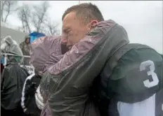  ?? Caitlin Lee/For the Post-Gazette ?? Ben McGregor hugs his mother after Pine-Richland’s season ended with a 37-0 loss to St. Joseph’s Prep in Altoona — one game shy of playing for the PIAA Class 6A title.