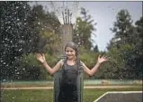  ?? Allen J. Schaben Los Angeles Times ?? LAURA MARTINEZ of Santa Ana cools off in a spray pool in Fountain Valley on Sept. 7.