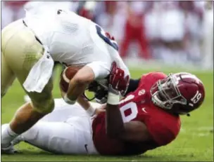  ?? BUTCH DILL — THE ASSOCIATED PRESS FILE ?? In this Saturday file photo, Alabama linebacker Reggie Ragland (19) sacks Charleston Southern quarterbac­k Kyle Copeland (19) during the first half of an NCAA football game, in Tuscaloosa, Ala. Alabama’s stout defensive front will face Clemson’s once...