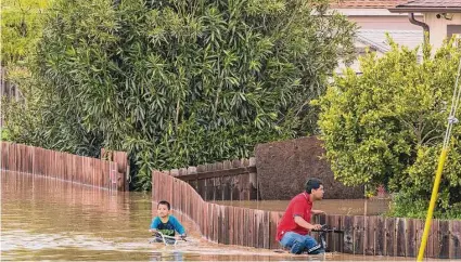  ?? Nic Coury/Associated Press ?? The Pajaro River’s levee was breached by flooding caused by a new atmospheri­c river. Thousands of residents had to evacuate.