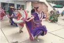  ??  ?? Ballet Folklorico dancers from Hayes Bilingual School perform during Milwaukee Public Schools' Year of the Arts launch in Red Arrow Park on Thursday.