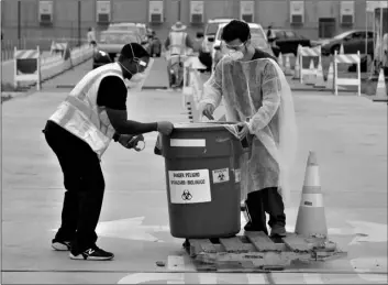  ?? AP Photo/Marcio Jose Sanchez ?? In this July 22 file photo, workers collect samples at a mobile coronaviru­s testing site in Los Angeles.