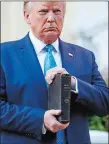  ?? PATRICK SEMANSKY, FILE/AP PHOTO ?? President Donald Trump holds a Bible outside St. John’s Church Monday. Could running for reelection on a law and order platform prove to be a winning strategy?
