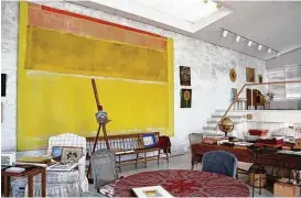  ?? Charlotte Moss ?? Bunny Mellon’s Oak Spring Garden Library holds a monumental 1954 Mark Rothko painting on whitewashe­d walls. French and Shaker furniture, as well as tables crafted on her farm, adorn the library landscape.