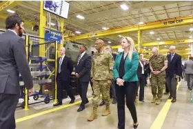  ?? ?? Chairman of the Joint Chiefs of Staff Charles Q. Brown Jr. (center right), tours Lockheed Martin Missiles and Fire Control Thursday in Camden. (Arkansas Democrat-Gazette/Staci Vandagriff)