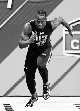  ?? BRIAN SPURLOCK, USA TODAY SPORTS ?? Washington wide receiver John Ross set the NFL scouting combine record with a 4.22-second 40-yard dash.