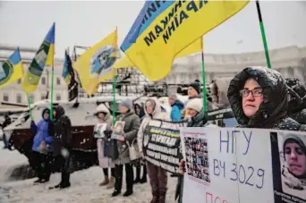  ?? Jeff J. Mitchell/Getty Images ?? Families of prisoners of war rally in Kyiv for a swap with Russia to free their loved ones. Russian attacks have killed an untold number of civilians and soldiers in the last nine months.