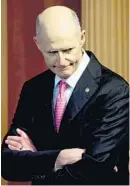  ?? ANDREW HARNIK/AP ?? Florida Sen. Rick Scott says Florida shouldn’t “bail out liberal politician­s” in states like New York for failing to make tough choices. He forgets that Obama stimulus sent $9 billion to Florida and allowed him to claim credit for the state’s economic recovery.