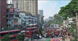  ?? ?? Garment factory workers block a road as they protest to demand their unpaid wages and benefits in Dhaka, Bangladesh.