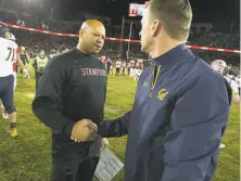  ?? D. Ross Cameron / Special to The Chronicle 2017 ?? On Thursday afternoon, neither Stanford head coach David Shaw, left, nor Cal’s Justin Wilcox, right, knew whether their teams would be able to play their respective games Saturday.