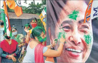  ??  ?? Trinamool Congress supporters celebrate their party’s victory in the assembly elections, in South Dinajpur district on Sunday.