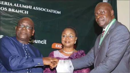  ??  ?? L-R: Mr. Michael Arokodare, his wife, Bola, and the National President of the University of Nigeria Alumni Associatio­n (UNAA), Sir Ben Okoronkwo, during the presentati­on of the Diamond Award to Arokodare at the National Executive Council meeting of the...