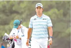  ?? - AFP photo ?? Hideki Matsuyama of Japan walks up to the 17th green during the third round of the Masters at Augusta National Golf Club on Saturday.