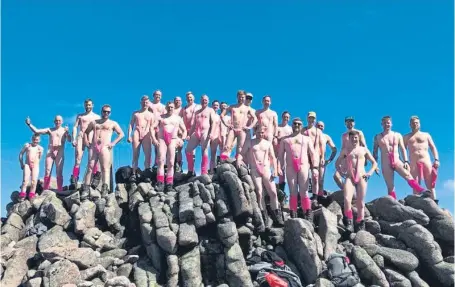  ??  ?? The hillwalker­s have only their mankinis to protect their modesty at the top of Mount Keen.