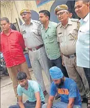  ?? HT PHOTO ?? The two arrested accused Dharmendra Yadav and Paramjeet Singh in police custody in Alwar.