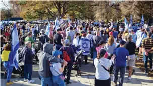  ?? (Eliot Penn) ?? A GATHERING and march take place in Washington Park in Denver to raise awareness of the plight of the hostages held by Hamas and to advocate for their safe return.