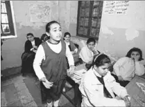  ?? Picture: ALAN POGUE ?? FROZEN: Layla speaks for her class at Baghdad’s Dijla Secondary School for Girls in 1999.