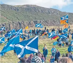  ??  ?? The All Under One Banner March saw independen­ce supporters march into Holyrood Park. Picture: Alamy