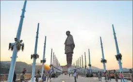  ?? AFP ?? Policemen stand guard near the Statue of Unity in Gujarat.