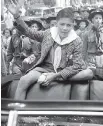  ?? THE ASSOCIATED PRESS ?? Donn Fendler, 12, his feet still bandaged from his days alone in the Maine woods, waves from the back of a car as he is honoured in his hometown of Rye, N.Y., in August 1939.