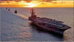  ?? NATHAN BURKE/US NAVY/AFP ?? The aircraft carrier USS leads Carrier Strike Group 5 during an exercise on June 29 in the Pacific.