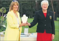  ??  ?? Pictured right, Fermoy Golf Club lady captain Marie Byrne presenting the winner Eileen O’Neill with her prize.