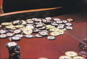  ?? Wayne Parry / Associated Press ?? This Feb. 22, 2019, photo shows chips piled in a corner of a table at the Golden Nugget casino in Atlantic City, N.J., between games.