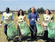  ??  ?? Bag it up From left Michael Odiamehi, Alison Vass, Craig Lawrie and Lynn McCulloch take part in the clean-up