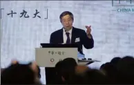  ?? ROY LIU/ CHINA DAILY ?? Yi Gang, deputy director of the General Office of the Central Leading Group for Financial and Economic Affairs, speaks at the public seminar on the 19th National Congress of the Communist Party of China in Wan Chai on Thursday. The seminar was...