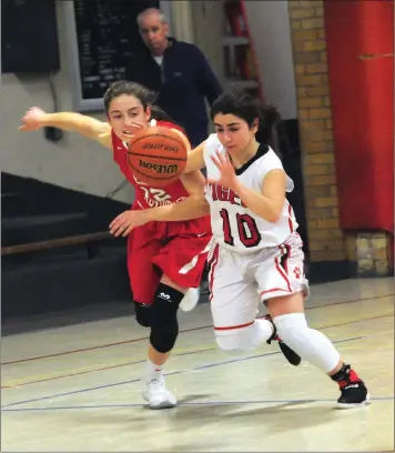  ?? Photo by Ernest A. Brown ?? Tolman junior guard Julia Al-Amir (10) steals the ball from East Providence senior guard Lillian Conti (12) during the second half of the Townies’ 60-44 Dvision II victory at Donaldson Gymnasium.