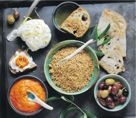  ??  ?? Make a tasty appetizer by serving harissa (bottom left), and dukkah (centre), with bread, olive oil, olives and labneh (top left). Add fresh cheese made with yogurt and you’ve got some great dishes.