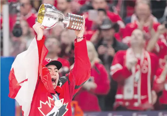  ?? THE CANADIAN PRESS ?? Team Canada captain Dillon Dube, one of six Calgary prospects at the world juniors, hoists the trophy following Canada’s 3-1 gold medal victory over Sweden.