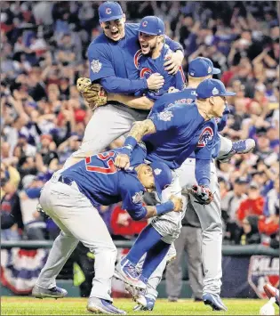  ?? AP PHOTO ?? In this November 2016 file photo, the Chicago Cubs celebrate after defeating the Cleveland Indians 8-7 in 10 innings in Game 7 of Major League Baseball’s World Series in Cleveland.