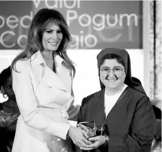 ??  ?? Melania presents Sister Carolin Tahhan Fachakh of Syria with the 2017 Secretary of State’s Internatio­nal Women of Courage (IWOC) Award during a ceremony at the State Department in Washington, US. — Reuters photo