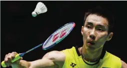  ??  ?? KUCHING: Lee Chong Wei of Malaysia hits a return to Wong Wing Ki Vincent of Hong Kong during their men’s singles semi-final match at the Malaysia Open Badminton Superserie­s in Kuching yesterday. —AFP