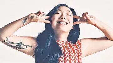  ??  ?? Awkwafina said that working on the movie was amazing, and they became a family in a way she had never really experience­d on a set before.